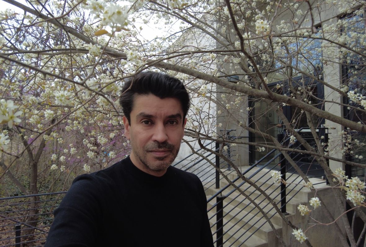 Rolando Vargas under flowering trees