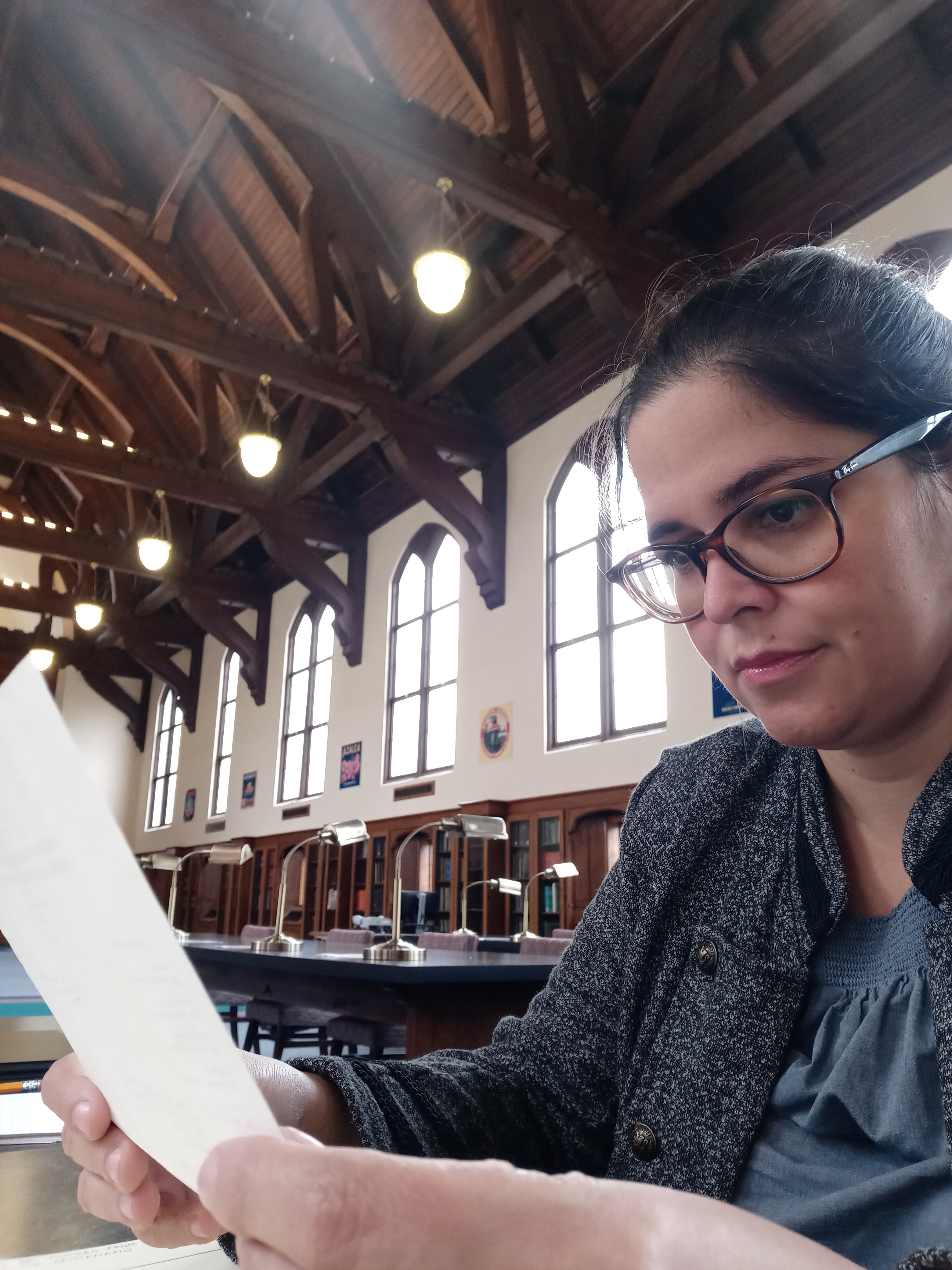 Elizabeth Mirabal, Ph.D. Student in the Department of Spanish at UVA, conducting research in the reading room of Special Collections, Smathers Library, University of Florida.