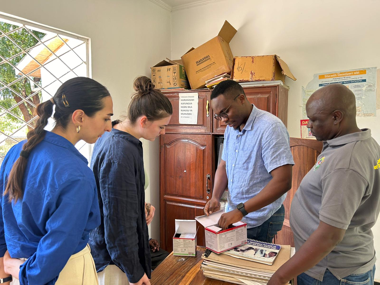 Saga shows students the contents of a box
