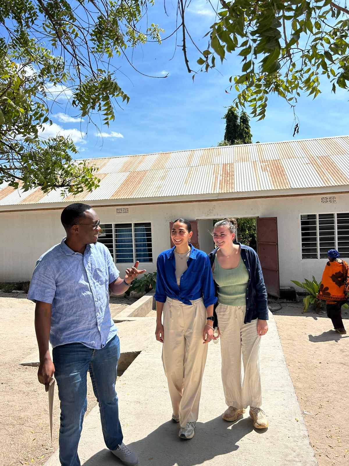 Saga and students walking around KIDH grounds