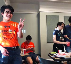 Sara Feng image student with peace sign fingers, other students in background