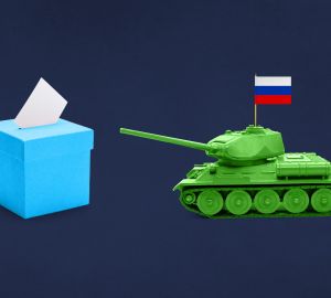 A box of tissues with a small tank pointing at it