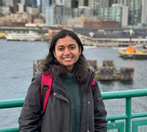 Anu Karippal with cityscape in the background